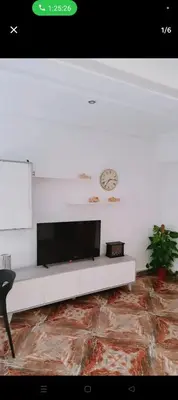 a living room with a tv on a white wall at Piso in Valencia