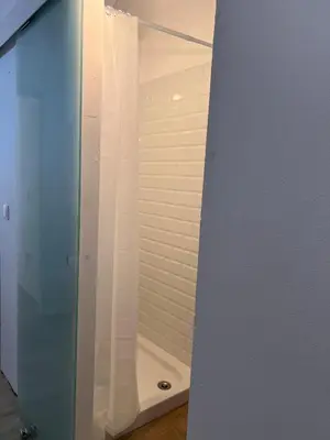 a shower stall with a glass door in a bathroom at Restored house near Valencia in Simat de Valldigna