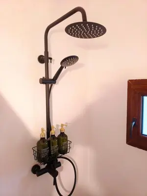 a wine bottle rack with bottles in it on a wall at Casa Abadía Alojamiento completo boutique cerca de Valencia in Alfarp