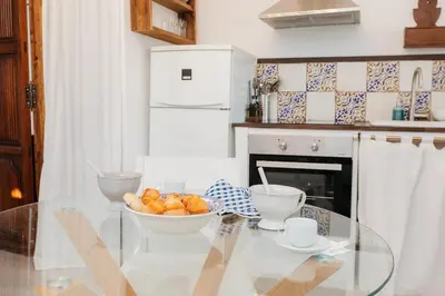 a glass table in a kitchen with a bowl of food at Brisas Chulilla Mirador House in Chulilla