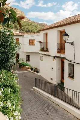 an alley in a house with a fence at Brisas Chulilla Mirador House in Chulilla
