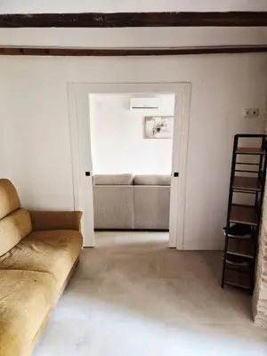 a living room with a couch and a chair at Valencia Catedral Apt in Valencia