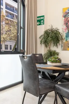 a dining room with a table and chairs at Portobello Road Suites in Valencia