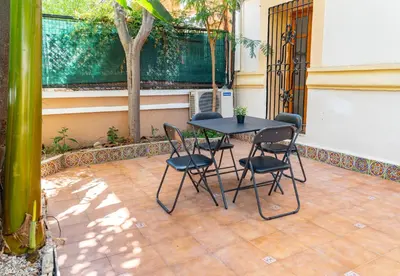 a table and chairs sitting on a patio at especial mediterranean room in Valencia