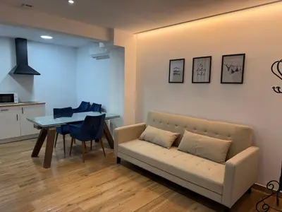 a living room with a couch and a table at Apartamento junto a la playa in Valencia
