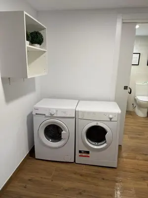 a laundry room with a washer and dryer at Apartamento junto a la playa in Valencia