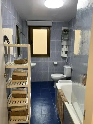 a bathroom with a sink and a toilet and a tub at La Llum de Serra in Serra