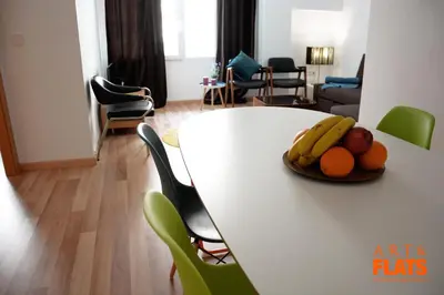 a white table with a plate of fruit on it at ART & FLATS Pleno Centro Valencia in Valencia