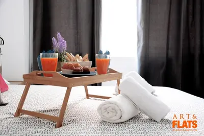 a coffee table with a tray of food and drinks at ART & FLATS Pleno Centro Valencia in Valencia