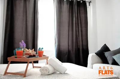 a living room with a bed and a coffee table at ART & FLATS Pleno Centro Valencia in Valencia