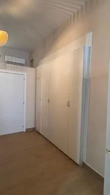 an empty room with white cabinets and a closet at Gran Loft en planta baja en el Centro de Valencia in Valencia