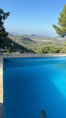 a swimming pool with a view of a mountain at El Cortijo a cielo abierto entre montañas in Estivella