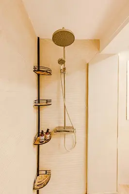 a bathroom with three shelves on the wall at The Cabanal Beach House - 10 min to ocean, FastWifi, AC, Coffee in Valencia