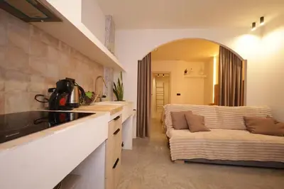 a kitchen with a couch in the middle of a room at Suite con terraza - Manolito 1 in Valencia