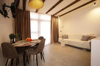 a room with a table and chairs and a bed at Suite junto Ciudad de las Ciencias - Manolito 2 in Valencia