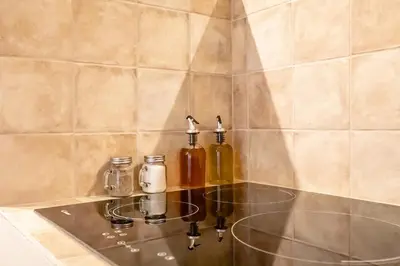 a glass counter top with two bottles on it at Eco suite Puerto - Manolito 3 in Valencia