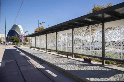 a building with a fence next to a street at Suite Ciudad de las Ciencias y Puerto - Manolito 4 in Valencia