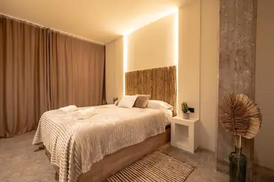 a bedroom with a bed and a large window at Suite Ciudad de las Ciencias y Puerto - Manolito 4 in Valencia