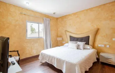 a bedroom with a white bed and a window at Valencia luxury in Valencia
