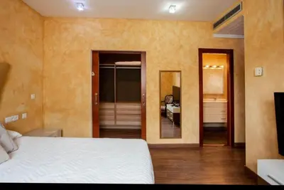 a bedroom with a bed and a room with a bathroom at Valencia luxury in Valencia
