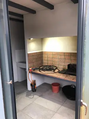 a kitchen with a stove and a counter top at White House with MINIGOLF 10 minutes from Cullera in Corbera de Alcira