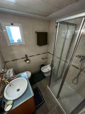 a bathroom with a shower and a sink and a toilet at Sientete como en casa in Sedaví