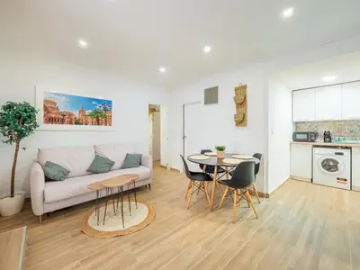 a living room with a couch and a table at Vivienda junto al Mercado Central in Valencia