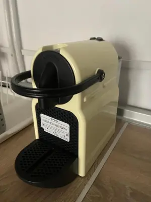 a toaster is sitting on top of a floor at Clau al castell apartament in Serra