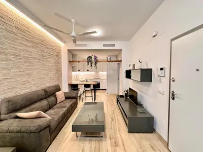 a living room with a couch and a table at Joaquin Costa Urban Flat in Valencia