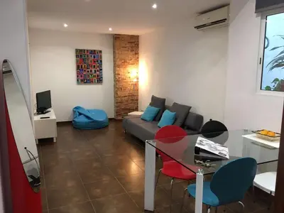 a living room with a couch and a table at Casa Cosy 2 in Valencia