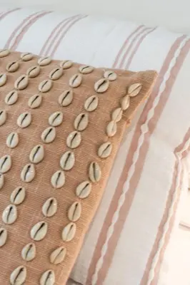 a bunch of seeds on a pillow on a bed at Cabanyal Rooms by VLC Host in Valencia
