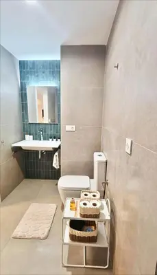 a bathroom with a toilet and a sink at New loft near the beach and downtown in Valencia