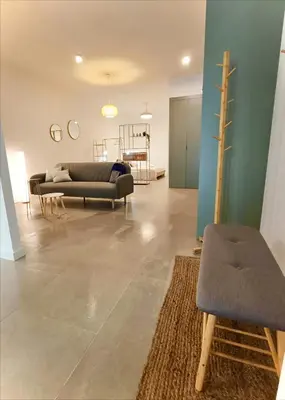 a living room with a couch and a chair at New loft near the beach and downtown in Valencia