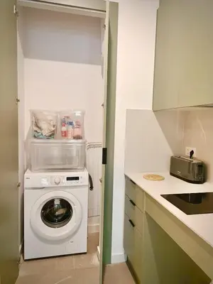 a kitchen with a washing machine in a kitchen at New loft near the beach and downtown in Valencia