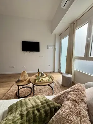 a living room with a couch and a table at Loft acogedor y luminoso in Valencia