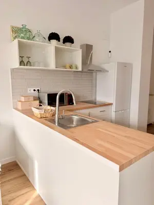 a kitchen with a sink and a counter top at Loft acogedor y luminoso in Valencia
