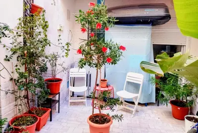 a red and white table with food and drinks on it at Casa Yaiza in Valencia