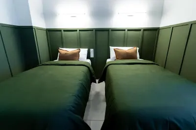 two beds sitting next to each other in a room at Casa Boutique Playa y Valencia in El Puig