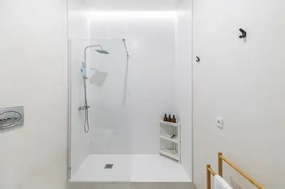 a white shower with a glass door in a bathroom at Modern & Stylish Apartment Close to the Beach in Valencia