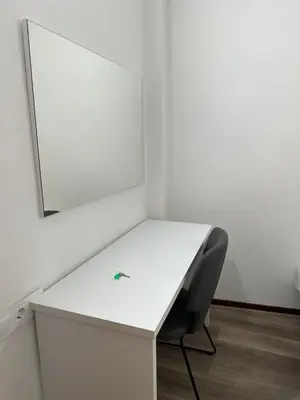a white desk with a chair and a mirror at Peixcateria mini in Sagunto