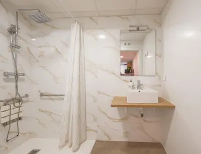 a bathroom with a sink and a mirror at Casa Estrellita Boutique Apartment in Valencia