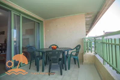 a black table and chairs on a balcony at Holiday Mare Nostrum in Valencia