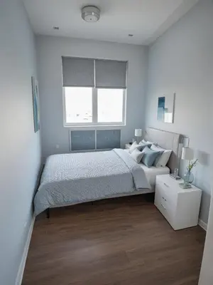 a white bedroom with a bed and a window at Malvarrosa Penthouse 4 rooms, suite, terrace and balcony in Valencia