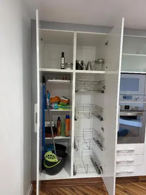 a white pantry with white cabinets and shelves at Malvarrosa Penthouse 4 rooms, suite, terrace and balcony in Valencia
