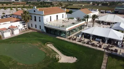 an aerial view of a house with a golf course at Cosy Flat Catarroja in Catarroja
