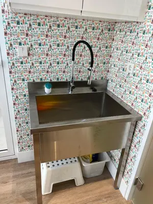 a stainless steel sink in a small kitchen at Bright spacious luxury apartment in Valencia