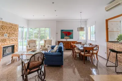 a living room with a blue couch and a table at Villa Azahar - Mediterranean Retreat in Benifayó