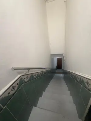 an empty room with a swimming pool in a building at Danner in Valencia
