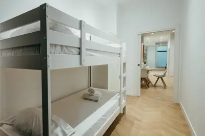 a bedroom with two bunk beds in a room at Sada Flat, Jacuzzi, Chill Out, 7 Pax, SmartTV in Valencia