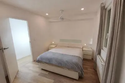 a small bedroom with a bed and a window at Valencia City Premium Terrace Apartment in Valencia